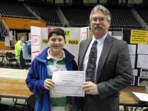 Zane H. of Jefferson Middle School received Honorable Mention for his project entitled “Asphalt: Which Car Product Will Break Down Asphalt the Fastest?”